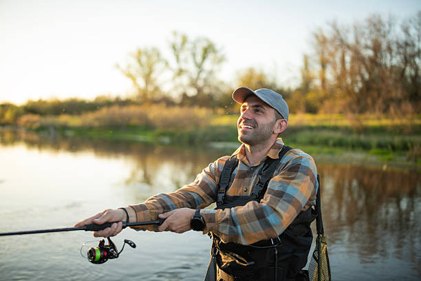 istock Satisfied fisherman in the river. 2213753126