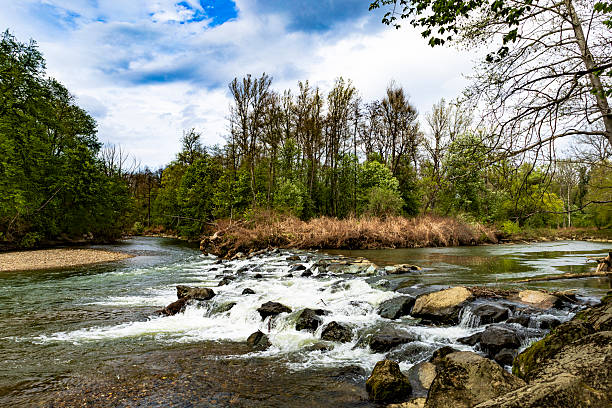 istock Serene Rapids Beneath Moody Overcast Skies 2213754256