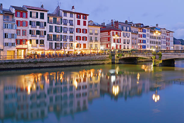Riverside cityscape at night (Bayonne, France).