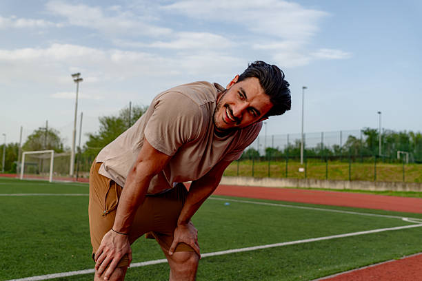 istock Young Male Athlete Catching Breath After Training on Running Track 2213758213