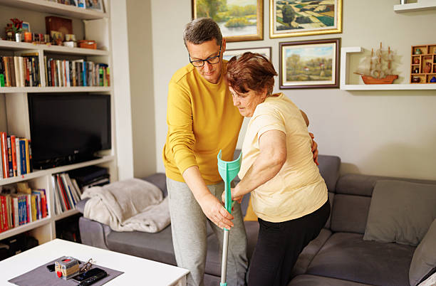 istock An Elderly Mother Balancing on a Crutch With Her Son's Help 2213761478