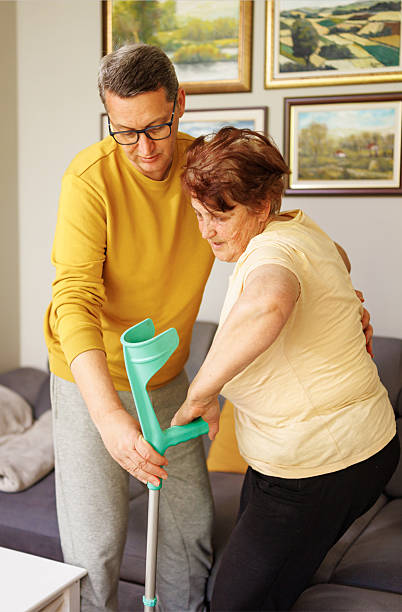 istock An Elderly Woman Accepting Her Son’s Steady Help To Stand 2213761481