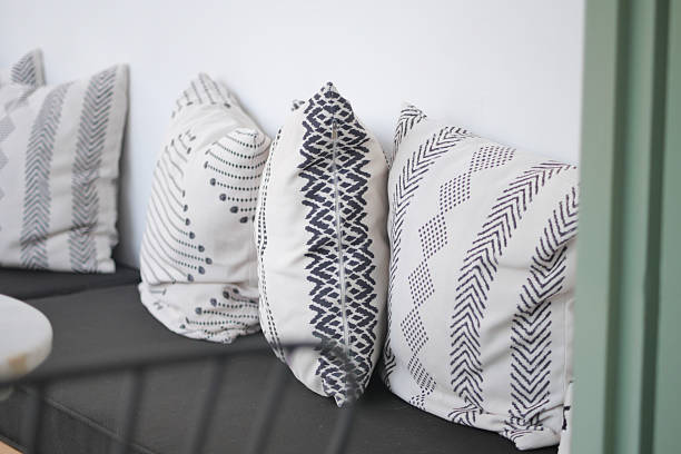 istock Beautiful and Stylish Decorative Cushions are resting on a Modern Sofa 2213762527