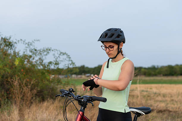 istock Female cyclist checking her smartwatch for ride statistics 2213763155