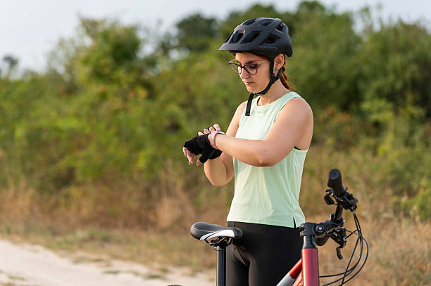 istock Female cyclist checking smartwatch before a ride 2213763392