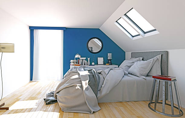 istock Bright attic bedroom with blue wall 2213763409