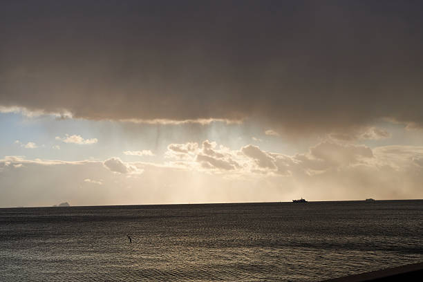sequence photos of seascape and clouds with rain formation