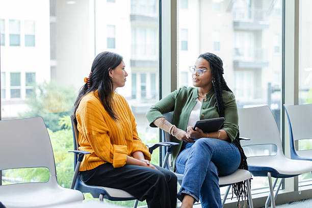 istock Two Diverse Women in Casual Clothes Talking, Counseling Session 2213764709