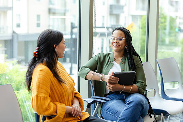 istock Two Women Talking During a Counseling Session 2213764714