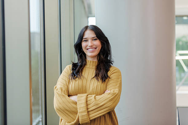 istock Confident Young Woman Smiling in Modern Office 2213764721