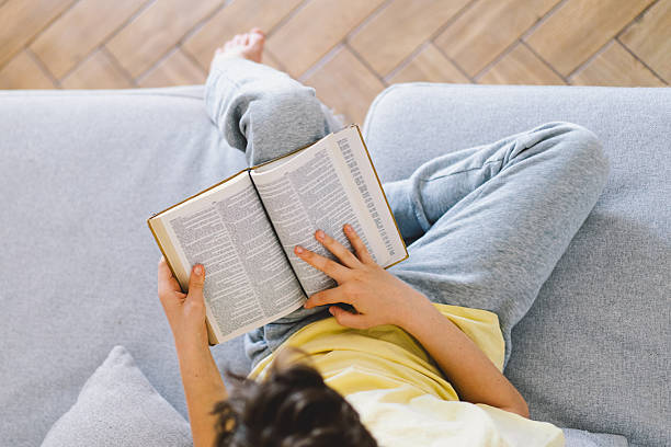 istock A boy is reading the holy bible 2213766997
