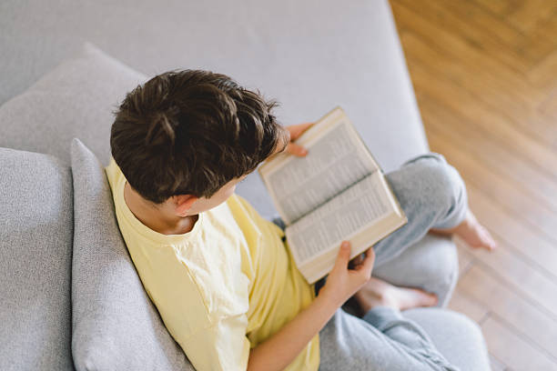 istock A boy is reading the holy bible 2213767005