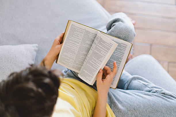 istock A boy is reading the holy bible 2213767009