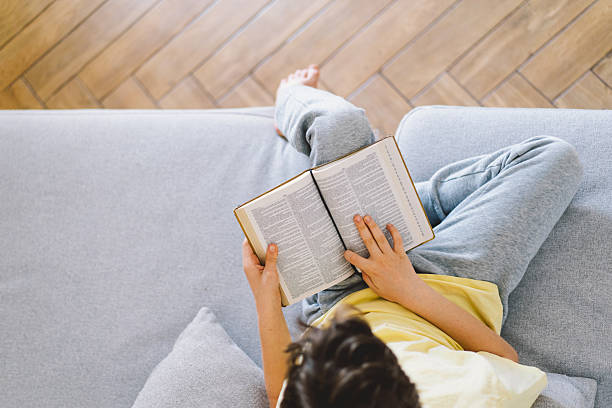 istock A boy is reading the holy bible 2213767013