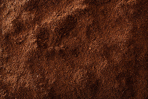 istock Brown background of ground coffee 2213767450