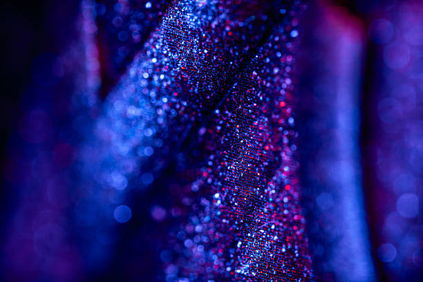 Fabric texture with shimmering silver sequins. Background with sequins.