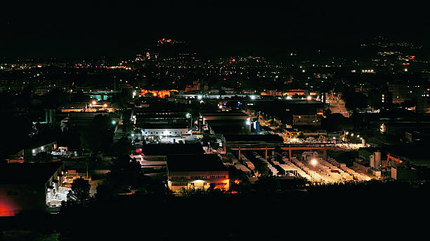 istock Modern industrial cityscape glowing at night time lapse 2213769692