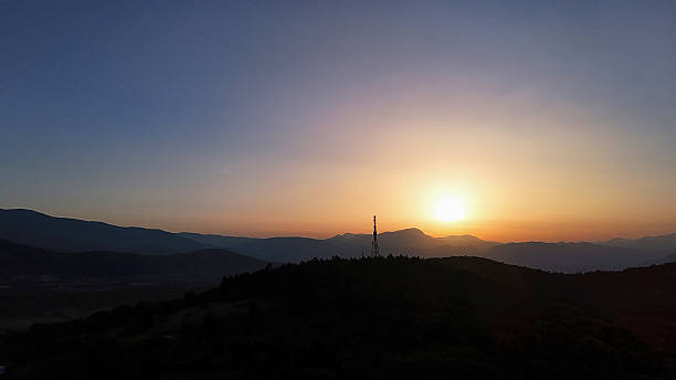 istock A tranquil twilight over rolling hills creates a serene landscape in the fading light of sunset 2213769816