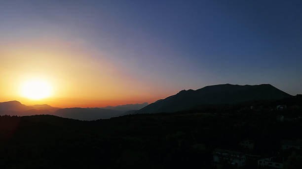 istock A tranquil twilight over rolling hills creates a serene landscape in the fading light of sunset 2213769851