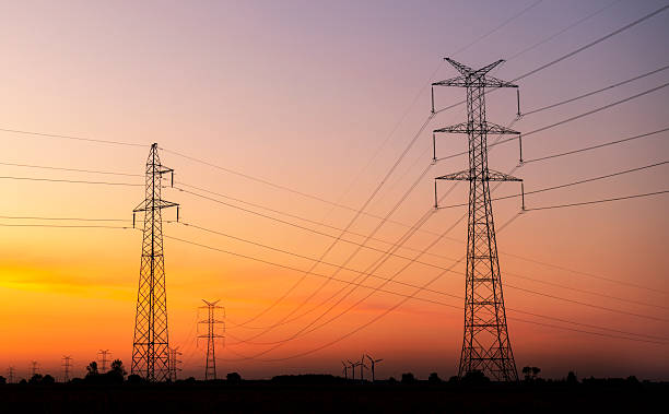 istock Electric pole over sunrise sky background 2213770128