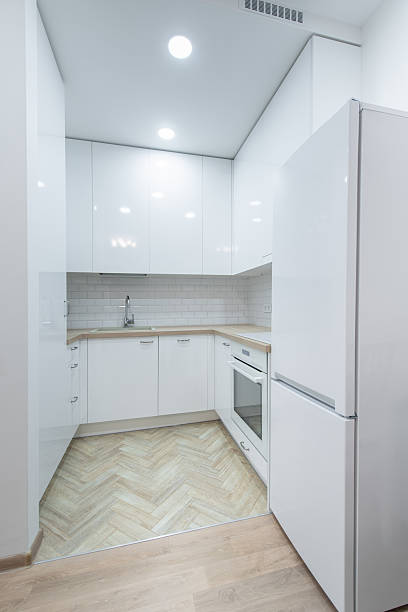 istock Modern White Kitchen Interior with Elegant Countertops and Appliances 2213775304
