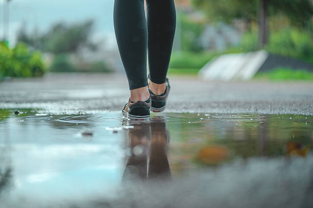 istock Walking through puddles on a rainy day 2213778094