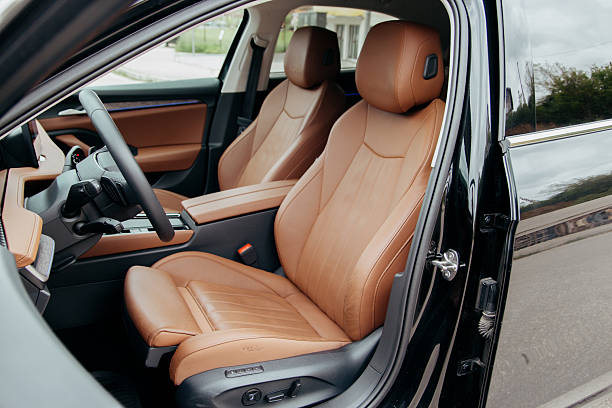istock Luxury vehicle interior with tan leather seats steering wheel and console details showcasing comfort and high end design 2213782003