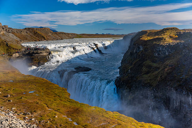 Gullfoss, a famous waterfall located on the Golden Circle route in Iceland. A powerful natural landmark surrounded by scenic landscapes and popular with tourists.