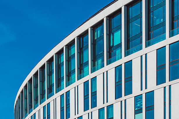 Modern architecture in liverpool showing a curved building with blue glass windows