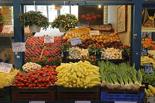 Delft, Netherlands, August 28, 2025. Fresh raw fruits and vegetables in a weekly local market stand. Top down view, prices displayed in Euros, no people
