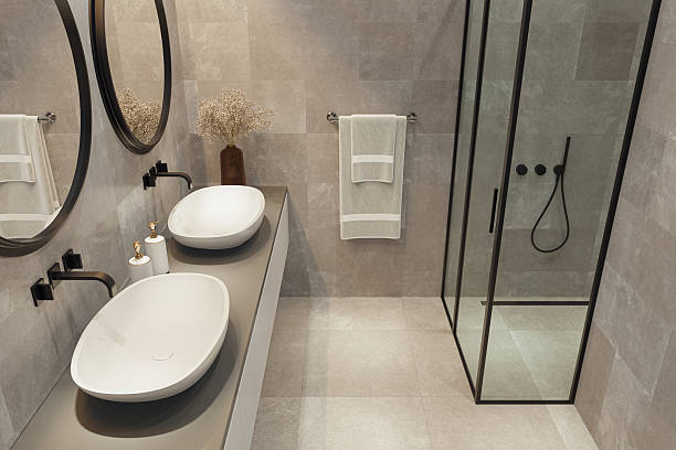 istock Modern Spa-Inspired Bathroom with Dual Sinks and Natural Stone Tiles 2213795592