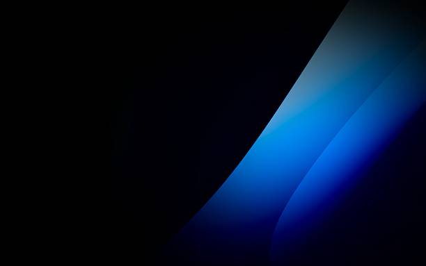 Smooth dark blue gradient waves flowing diagonally across a stark black background, elegant design