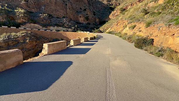 istock Winding Mountain Road surrounded by a breathtaking scenic landscape, ready for exploration 2213802707