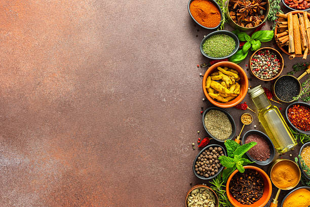istock A diverse collection of vibrant spices and herbs, elegantly positioned on a brown backdrop, exuding natural beauty and a burst of fragrances 2213809972