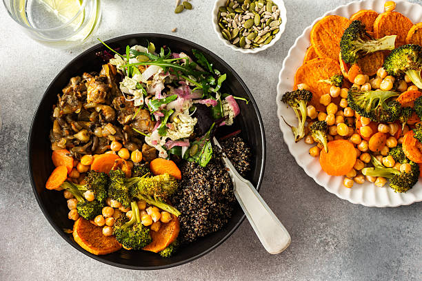 istock A nutritious breakfast bowl with black quinoa, avocado, roasted chicken, sweet potatoes, zucchini, and broccoli, paired with a fresh salad of cabbage, radish, chia, and sesame seeds 2213809973