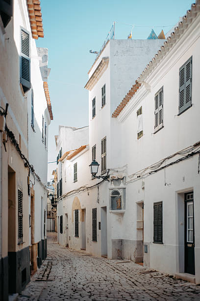 istock Whitewashed alley with shutters in Ciutadella, Menorca 2213812657