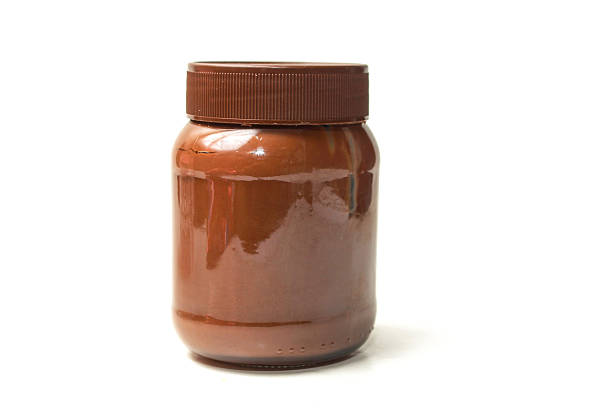 istock chocolate spread jar seen from the side, lid closed, isolated on white background 2213814916