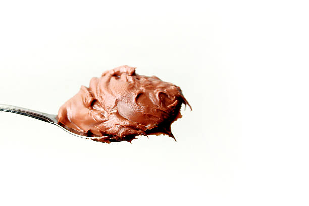 istock chocolate spread on spoon, isolated on white background 2213815835