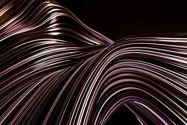istock Abstract shimmering wavy lines, elegant modern design, metallic effect on dark background, luxury texture wallpaper 2213817260