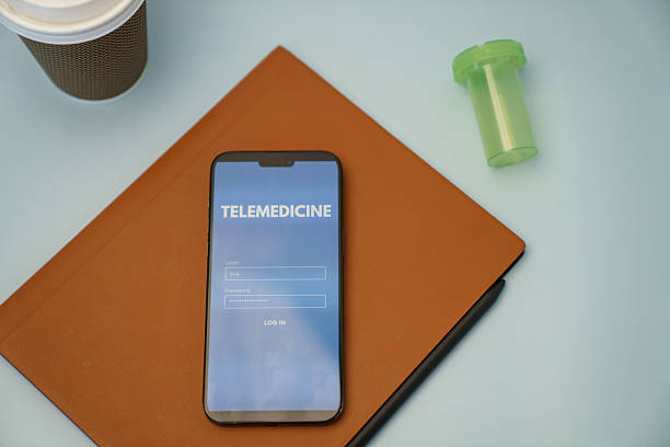 istock Telemedicine Login Screen Displayed on Smartphone with Related Items on Desk 2213817909