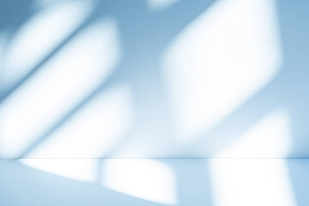 istock Studio style background wall decoration presentation uses white and blue tones. with shadows cast from a nearby window, concept creating a decorative 2213823254
