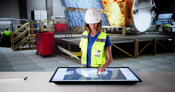istock Female Scientist Constructing Satellite In Aerospace Laboratory 2213824699