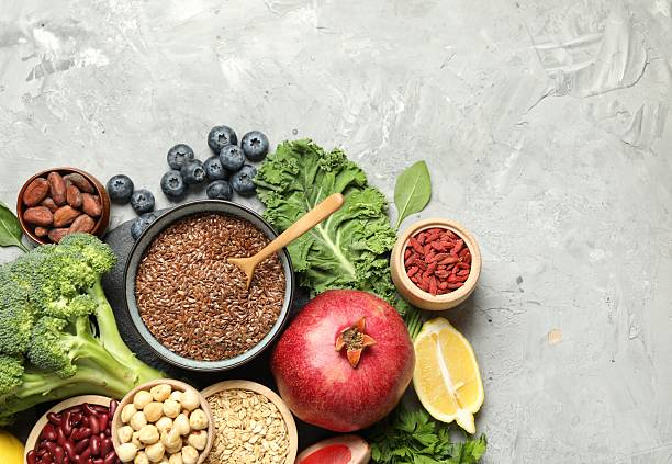 istock Different superfood products on grey table, flat lay. Space for text 2213825865