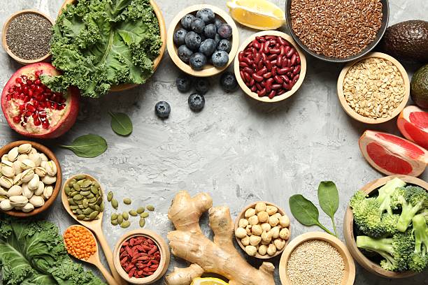 istock Frame of different superfood products on grey table, flat lay. Space for text 2213825880