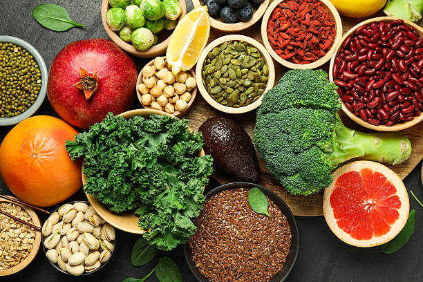 istock Different superfood products on black table, flat lay 2213825904