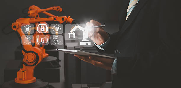istock Industry engineer in smart factory using transparent glass tablet to control automated robotic arm with AI and 5G network, machine learning technology, business innovation in industry 4.0 era 2213828557