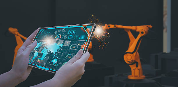 istock Industry engineer in smart factory using transparent glass tablet to control automated robotic arm with AI and 5G network, machine learning technology, business innovation in industry 4.0 era 2213828565