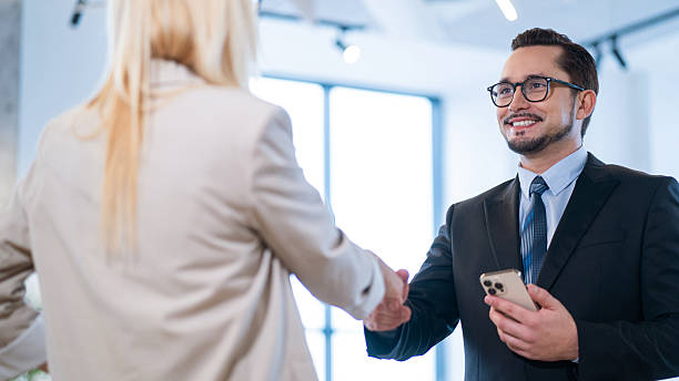 istock Professional business handshake between two colleagues in a modern office environment. 2213829546