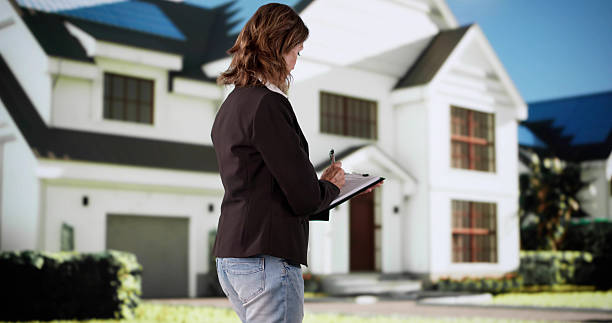 istock Professional Real Estate Agent Conducts House Appraisal 2213829671