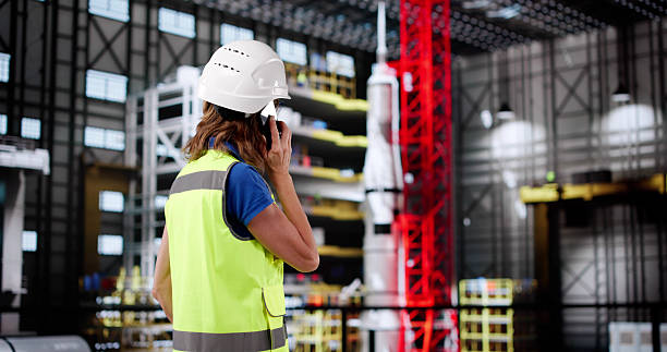 istock Female Engineer Conducting Phone Call Inside Aerospace Manufacturing 2213829697